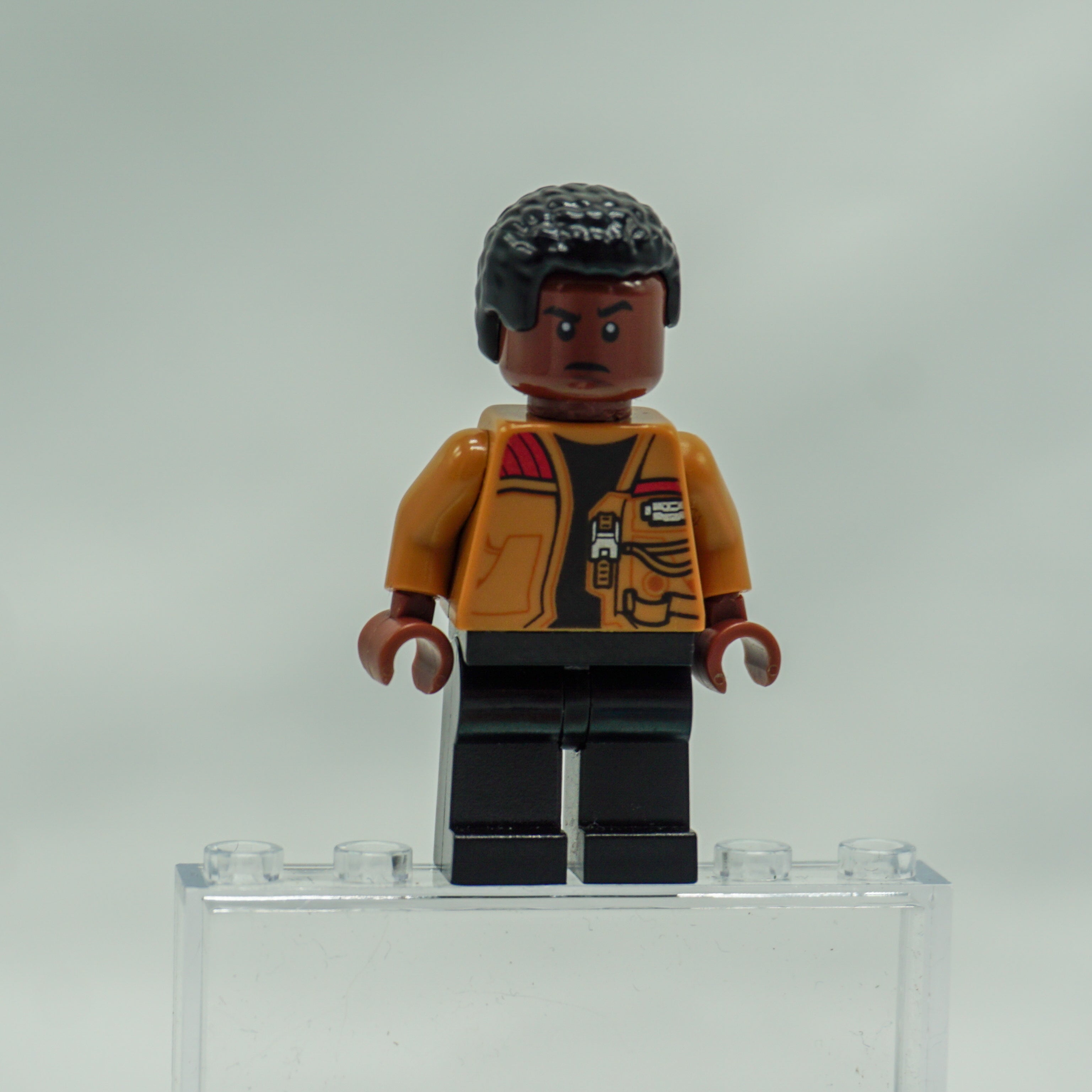Minifig sw0676 - Finn - Medium Nougat Jacket, Black Legs